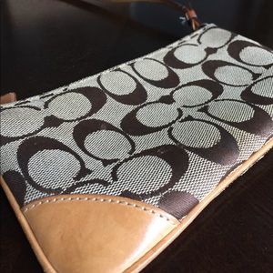 Tan Coach cross body clutch