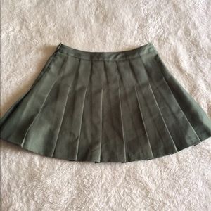 Pleated olive green skirt.
