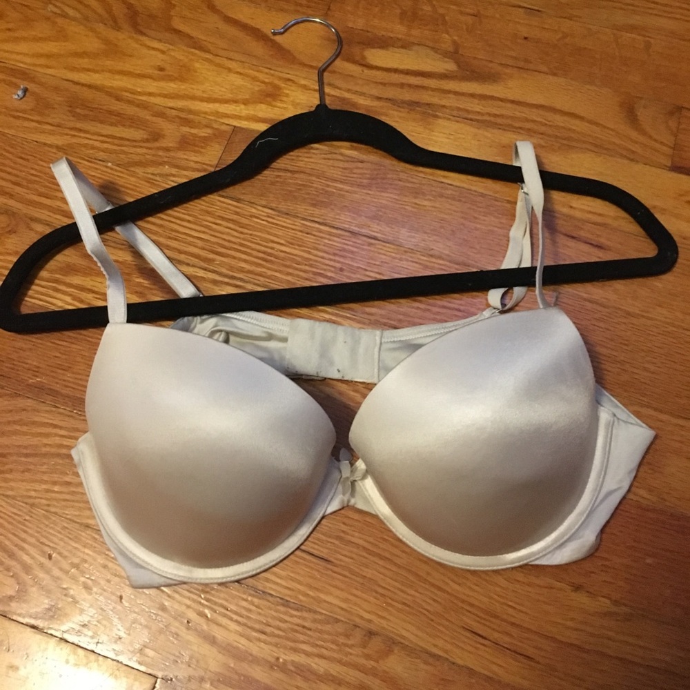 36C. Cream colored bra.