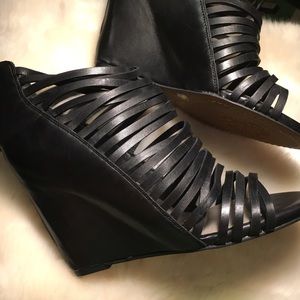 NWB Vince Camuto black leather zippered wedges.