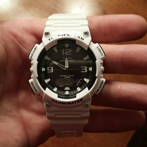 A white Casio watch and A midnight black Casio