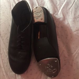 Lightly worn tap shoes.