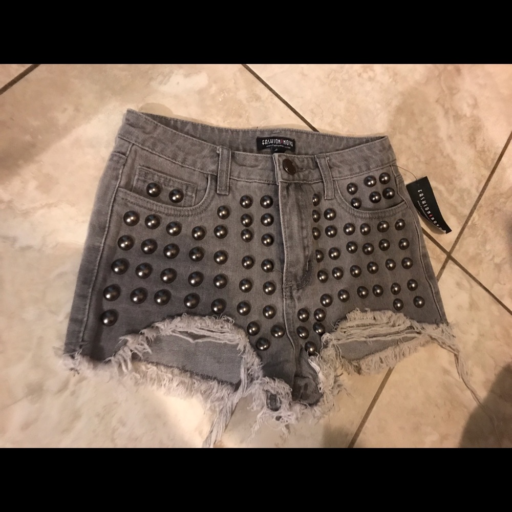 Gray distressed beaded shorts.