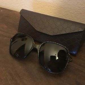 Gucci sunglasses black and gold.