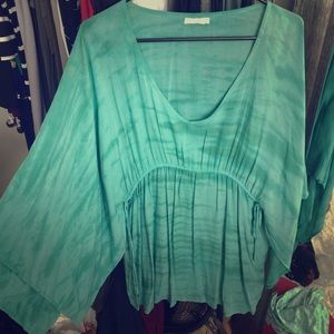 Green dress by Indah.