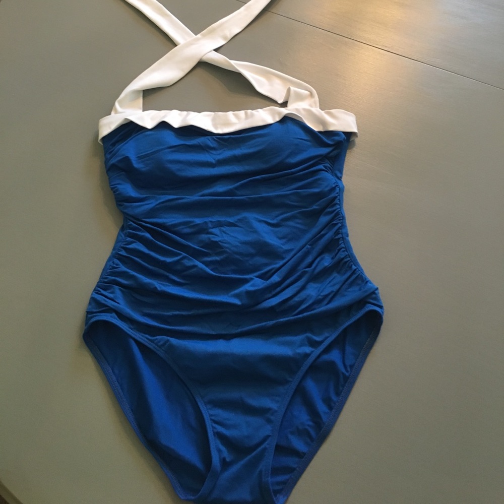 One piece. Blue with white tie around neck.