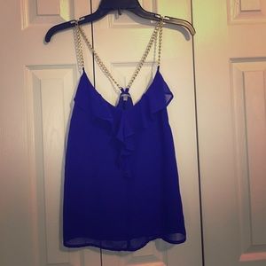 Gold chain and royal blue tank top