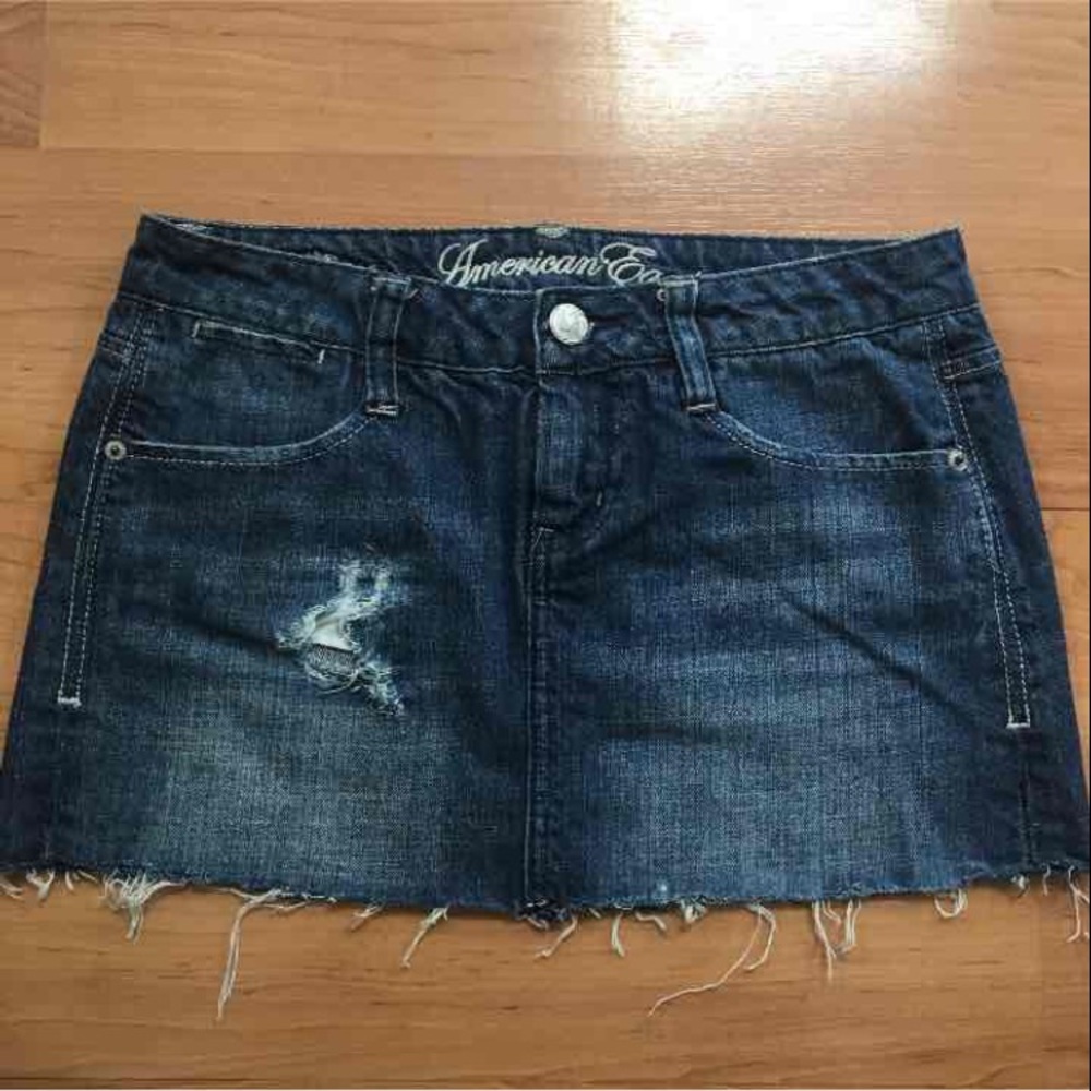 Distressed denim mini skirt