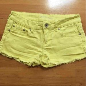 Yellow cutoff jean shorts
