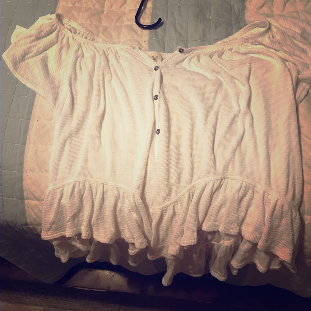 Across the shoulders white shirt