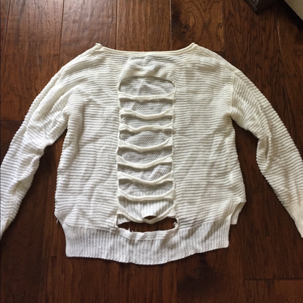 Cream crew neck sweater with back cutouts