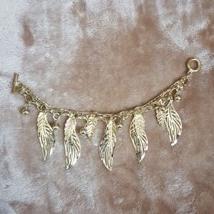 Gold colored feather bracelet