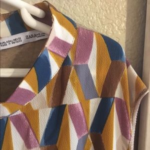 Colored-checkered top.