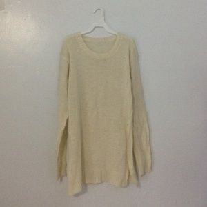 Cream knit pullover with long side slits