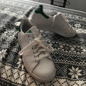 White Stan smith's with green accent.