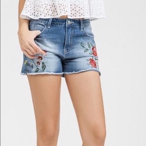 Embroidered denim cutoff shorts