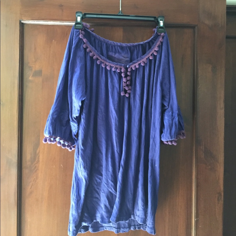 Purple shirt with pom-pom detail
