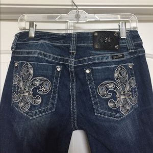 Light wash bedazzled miss me boot cut jeans