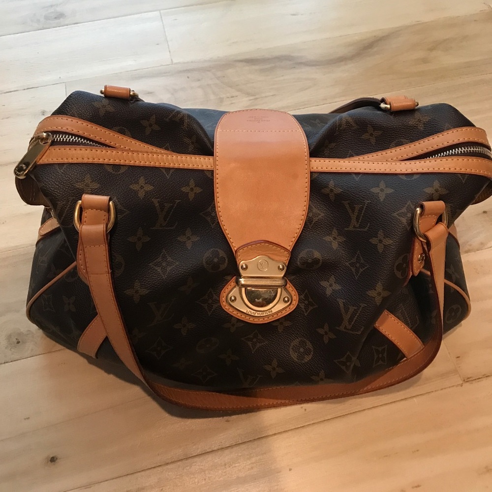Louis Vuitton handbag, brown colored bag.