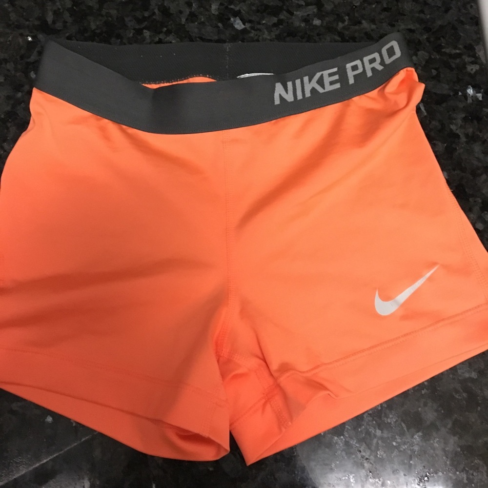 Orange Nike pro shorts
