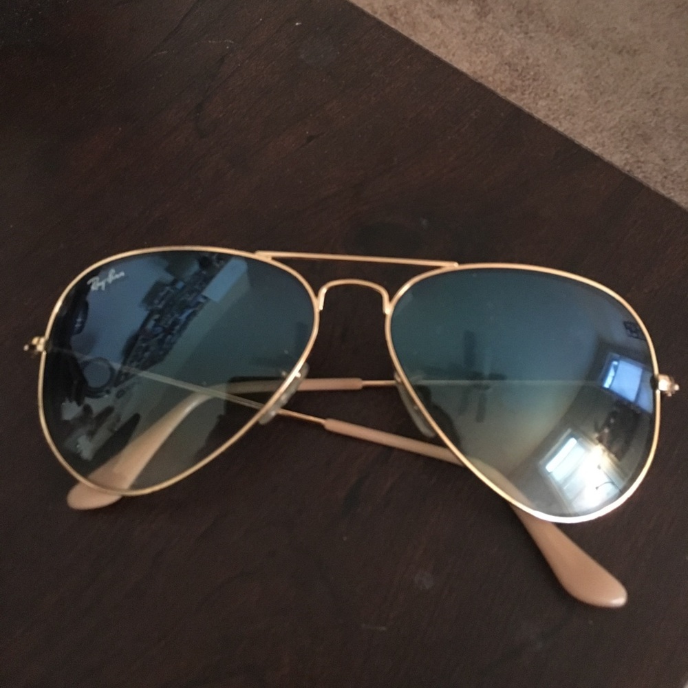 Light blue faded gold rimmed RayBans