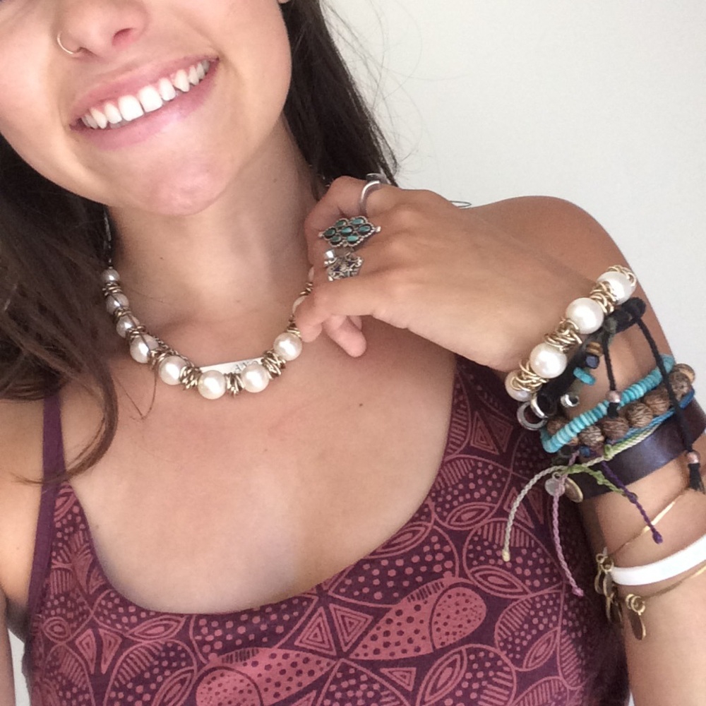 Pearl like and gold necklace.