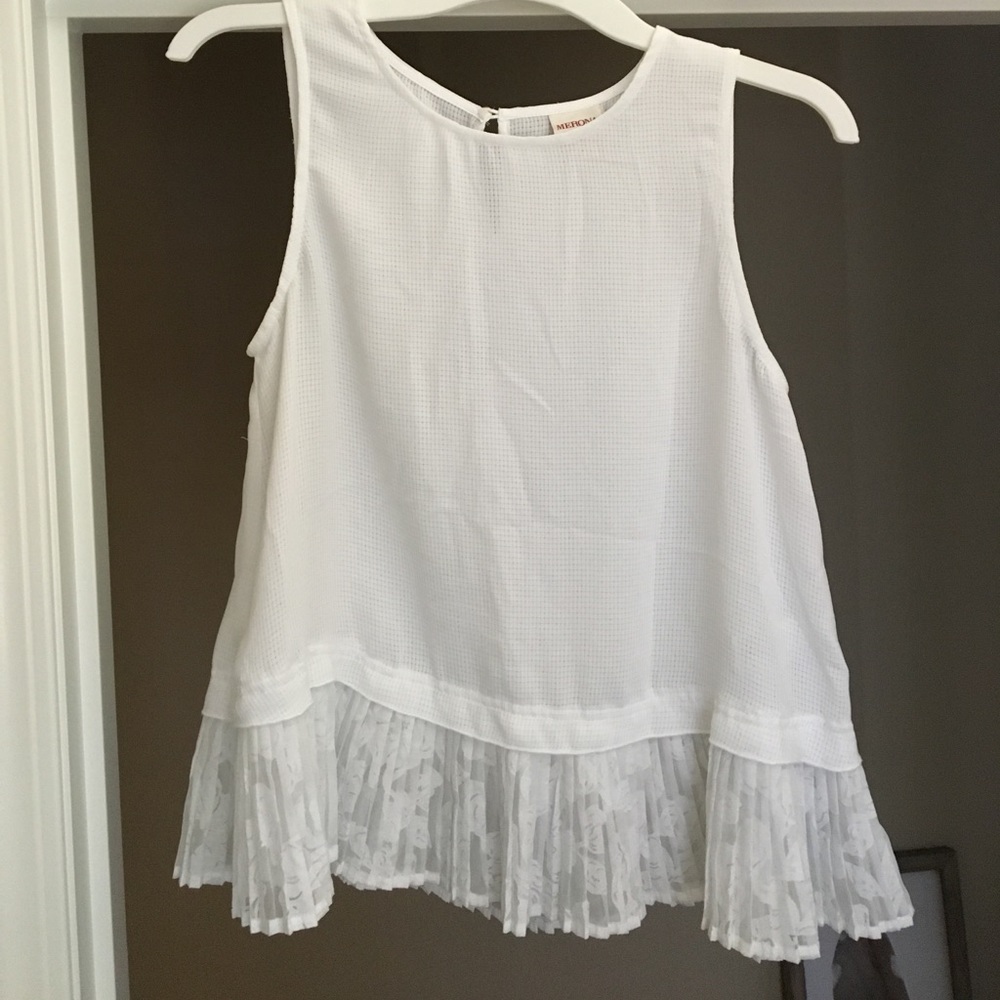 Small, white peplum blouse.