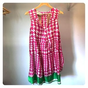 Pink and white patterned dress with green hem