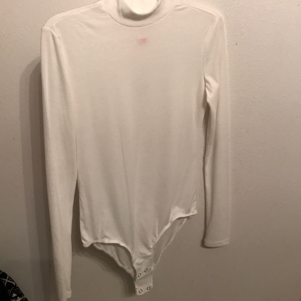 White long sleeve body suit.