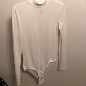 White long sleeve body suit.