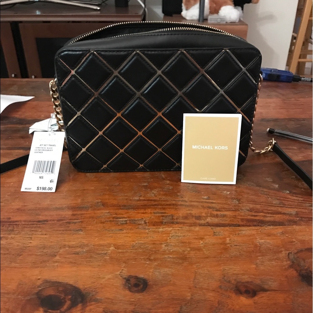 Lg Mk Black with gold chain jet set travel bag