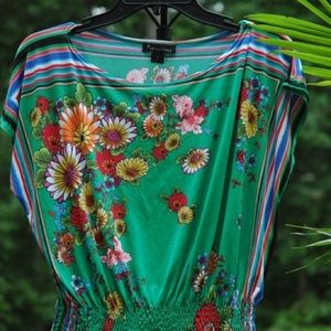 Green blouse with red and yellow accent flowers