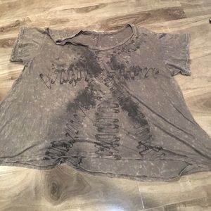 grey tee shirt with safety pins