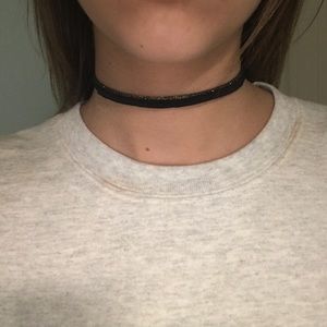 black choker with gold trim