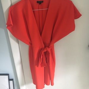 Adorable orange-red mini wrap dress.