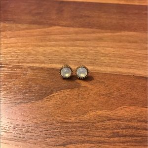 Gold earrings with a white moonstone