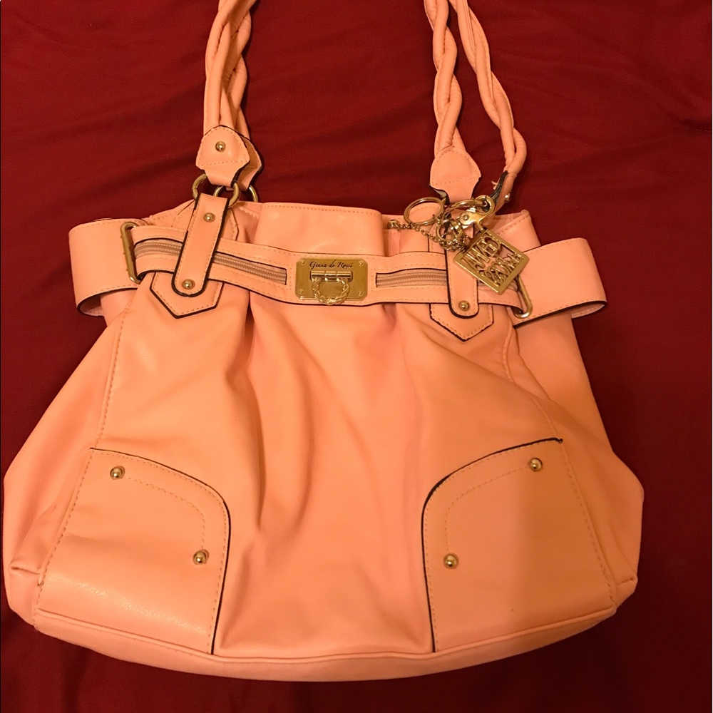 Pink hand bag by Jenna de Rossi.