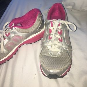 Grey and pink Nike running shoes