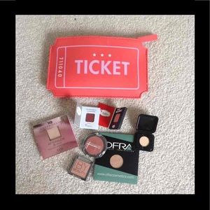 Make up bag, highlighters,  eyeshadow, and blush