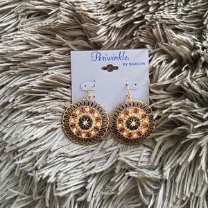 Gold earrings by Barlow