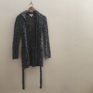 Thick knitted long cardigan. Buttoned down w/ hood