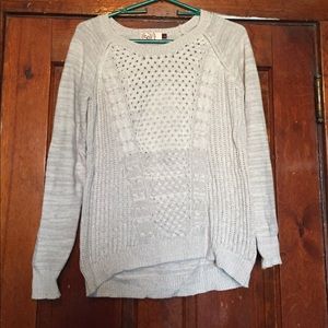 A tan-gray sweater