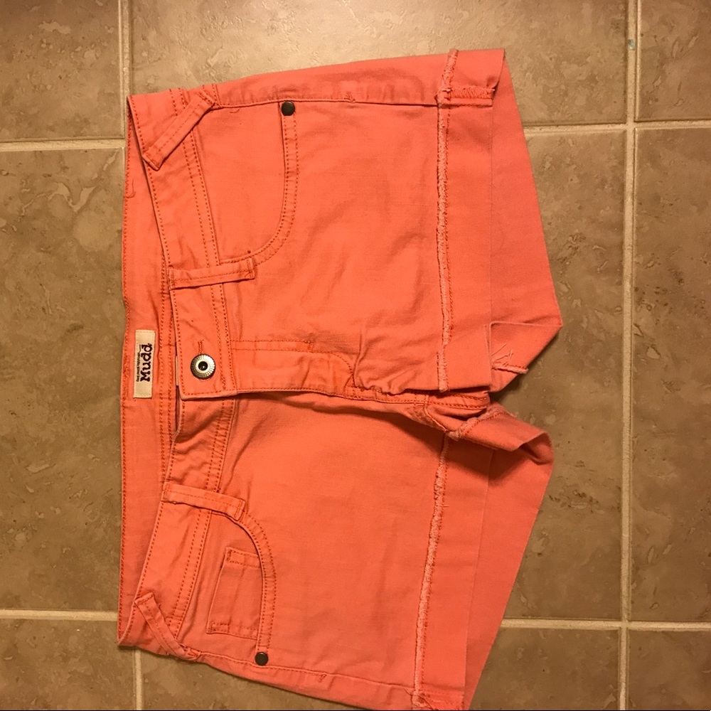 Faded pink jean shorts