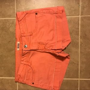 Faded pink jean shorts