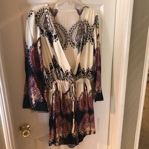 White romper with multicolored paisley detailing