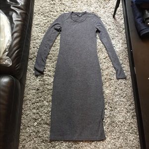 Tight below the knee grey dress.