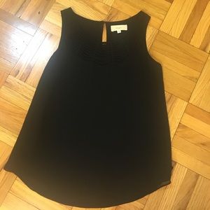 Black top with detailed neckline