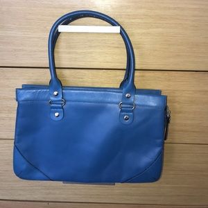 Blue Kate Spade purse.  Top handle multi pocket.