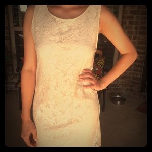 Lacy mid length cream dress.