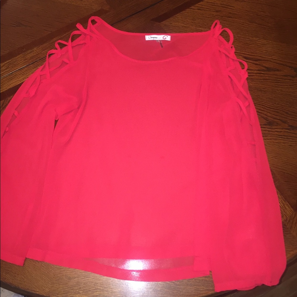 Red sheer top with intricate cut out arms
